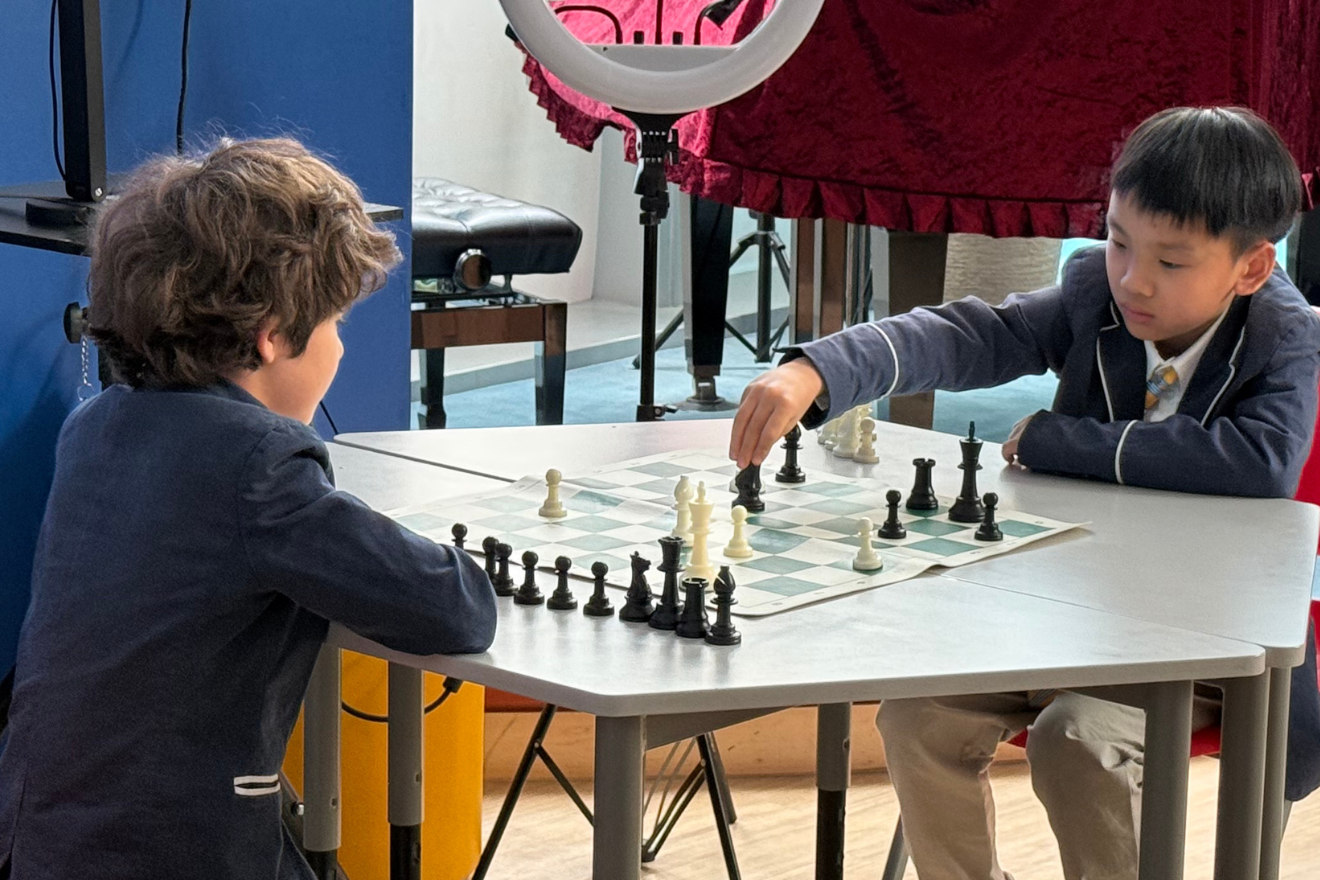 Primary school students at a chess match 